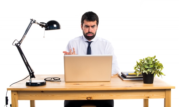 Tired businessman in his office