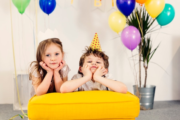 Free photo tired children on birthday party