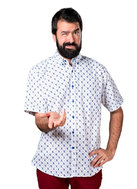 Tired handsome brunette man with beard