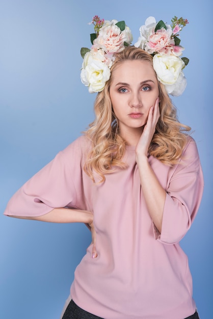 Tired lady with flowers on head 