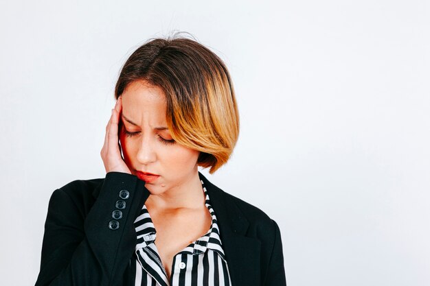 Tired woman having head pain