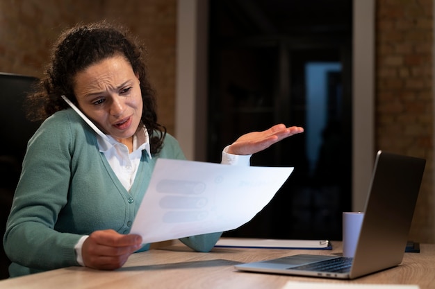 Free photo tired woman working late for a deadline