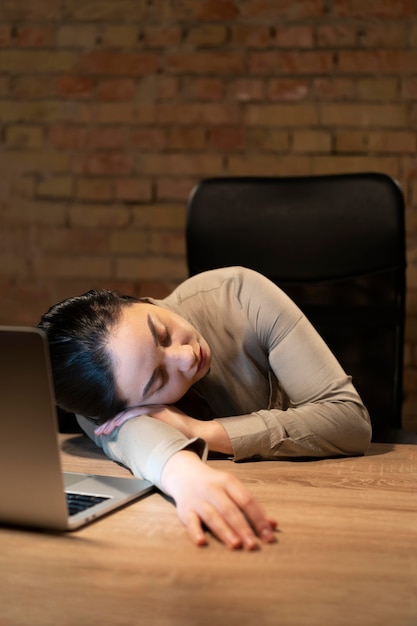 Tired woman working late for a project