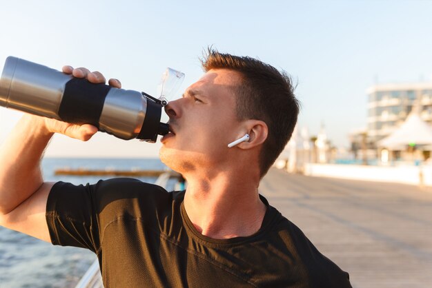 Download Premium Photo Sport Man Over Yellow Wall With Sports Water Bottle Yellowimages Mockups