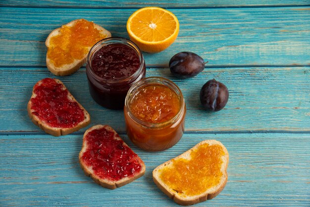 Toast breads with fruit confitures.