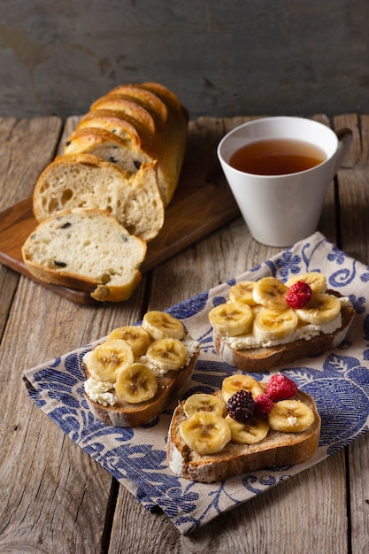 Toast with bananas and forest fruits