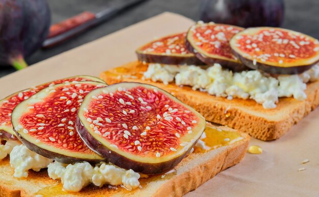 Toast with figs honey and ricotta cheese closeup Selective focus on bruchetta breakfast idea or photo for menu mediterranean breakfast
