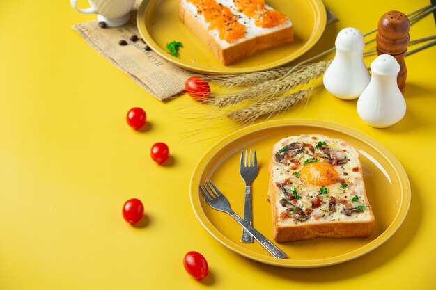 toast with fried egg and cream cheese on table