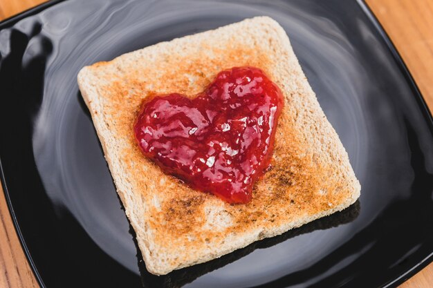 Toast with heart-shaped jam