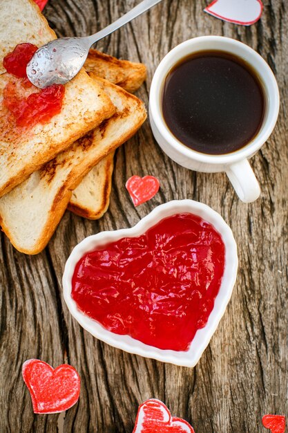 Toast with strawberry jam in a heart shape Valentine's Day