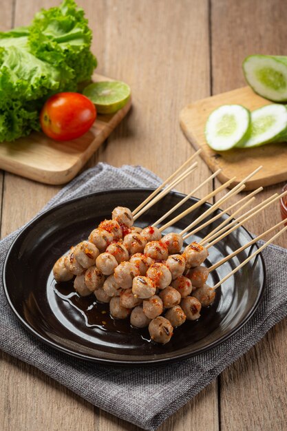 Toasted meatballs topped with spicy sauce