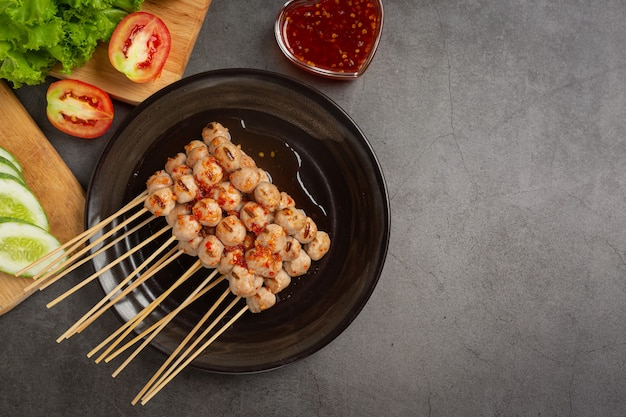 Toasted meatballs topped with spicy sauce