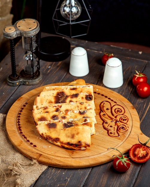 Toasted quesadilla on a wooden board