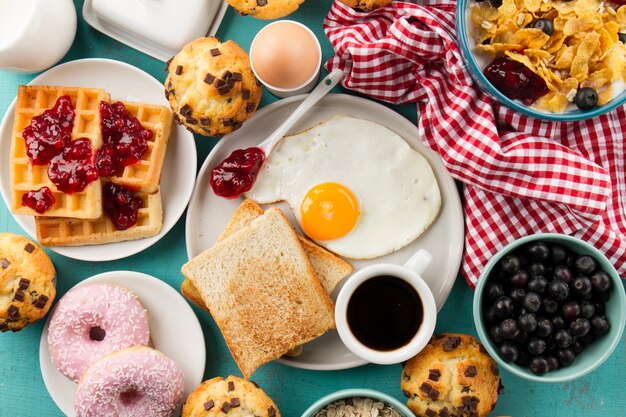 Toasts, fried egg and coffee on plate