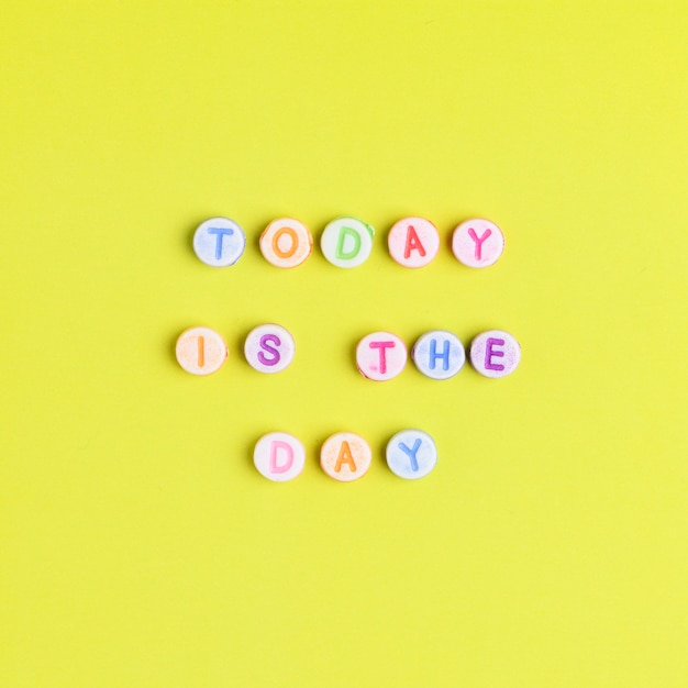 Free photo today is the day beads text typography on yellow