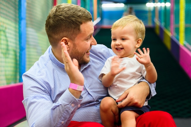 Toddler and father high fiving