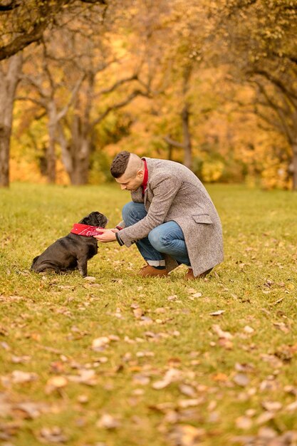 Together. A pet owner on the walk with his friend