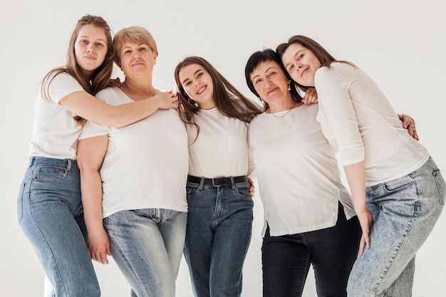 Free photo togetherness group of women hugging each other