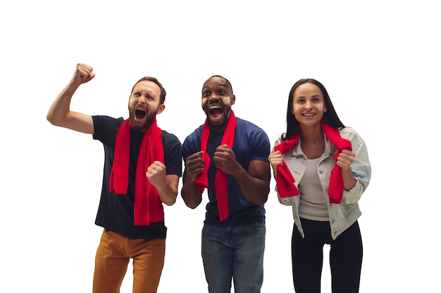 Togetherness. Multiethnic soccer fans cheering for favorite team with bright emotions isolated on white background.