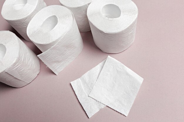 Toilet paper on pink background