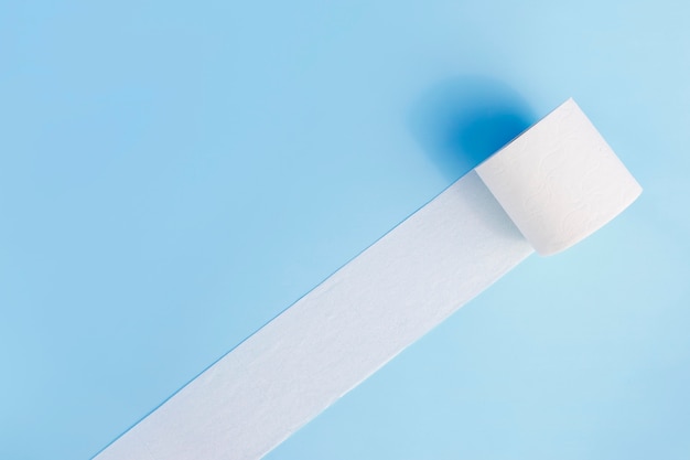 Toilet paper roll unfolded on desk