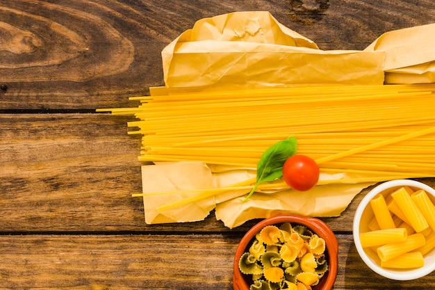 Tomato and basil leaf on pasta