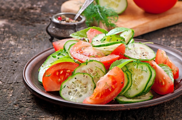 Tomato and cucumber salad with black pepper and basil