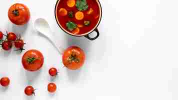 Free photo tomato soup and spoon top view