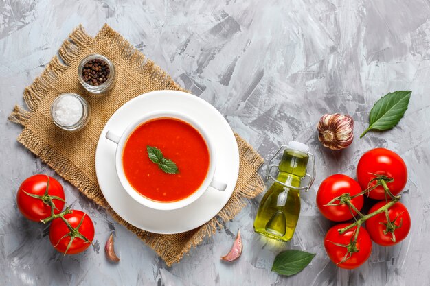 Tomato soup with basil in a bowl.