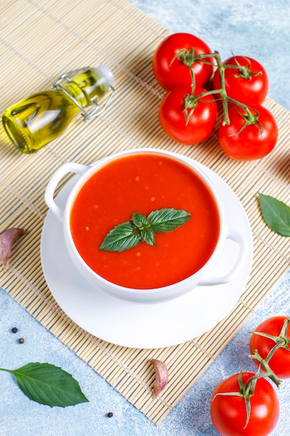 Tomato soup with basil in a bowl.