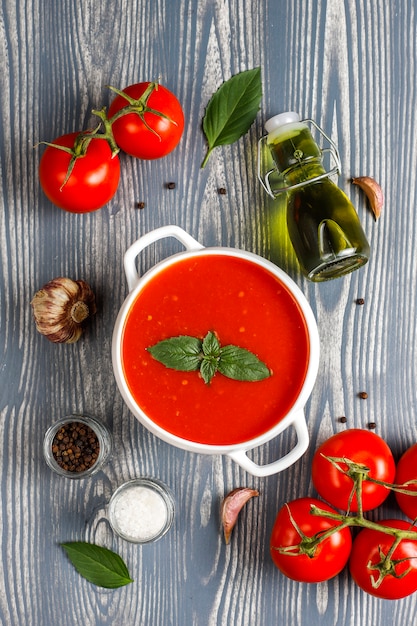 Tomato soup with basil in a bowl.