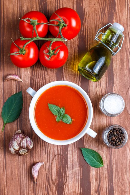 Tomato soup with basil in a bowl.