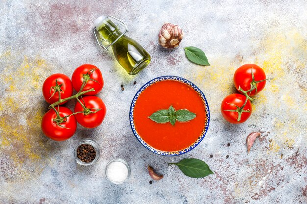 Tomato soup with basil in a bowl.