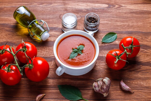 Tomato soup with basil in a bowl.