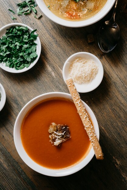 Tomato soup with cheese and cracker on top