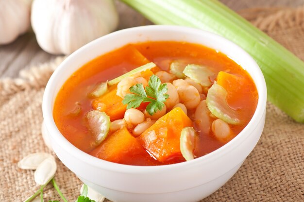 Tomato soup with pumpkin, beans and celery