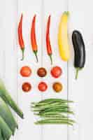 Free photo tomatoes and eggplant on white background