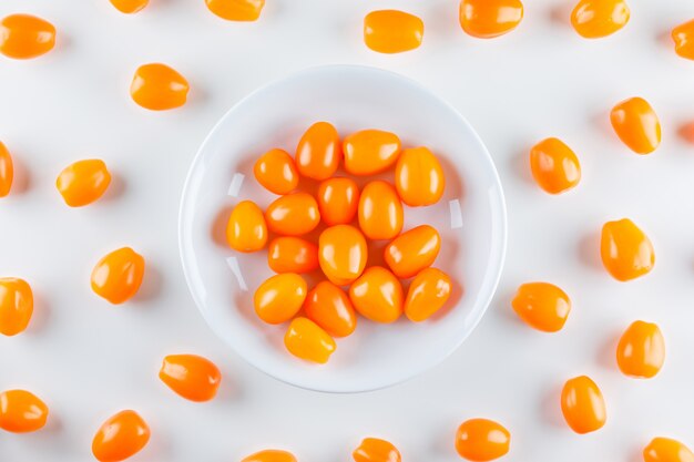 Tomatoes in a plate. flat lay.