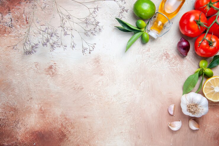 Free Photo tomatoes tomatoes lemon leaves garlic bottle of oil tree branches