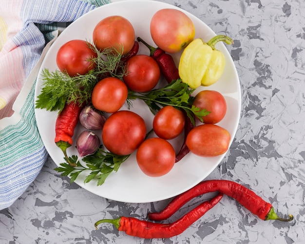 Tomatoes and vegetables harvest top view