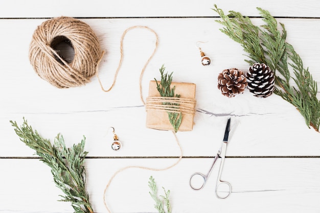 Tools and decorations for wrapping Christmas present