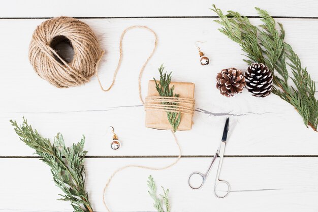 Tools and decorations for wrapping Christmas present