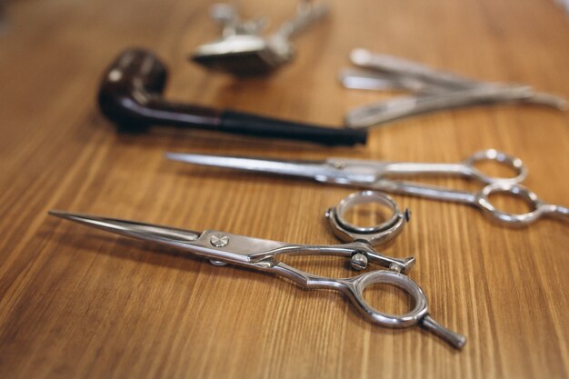 Tools from barbershop on wooden background