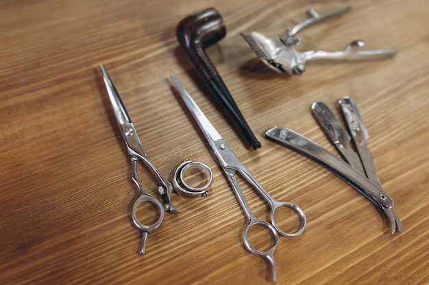 Tools from barbershop on wooden background