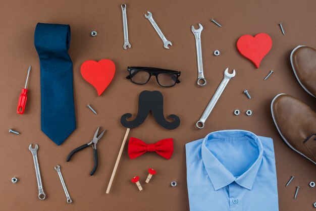 Tools with man clothes on brown table