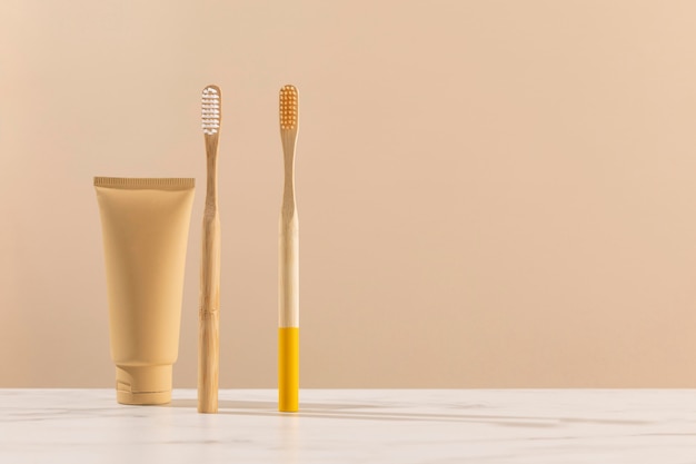 Free photo toothbrushes and cream container