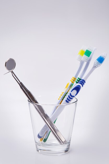 Toothbrushes in a glass