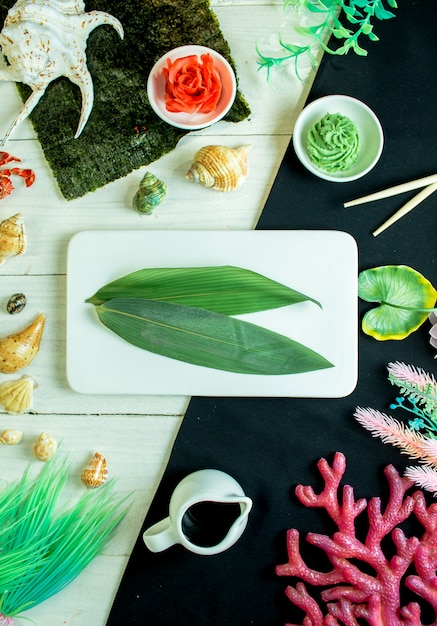 Free photo top  bamboo leaf with ginger and wasabi