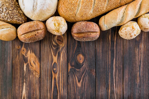 Top border made with different breads on the wooden plank