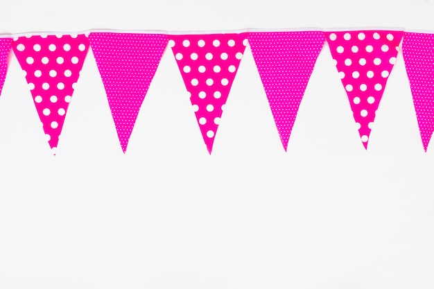 Top bottom made with pink bunting flag on white backdrop